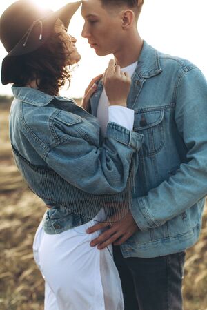 Young beautiful lovers. A man and a woman are resting in nature.の写真素材
