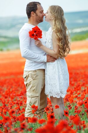 Loving couple in nature. Beautiful man and woman are hugging outdoors.の写真素材