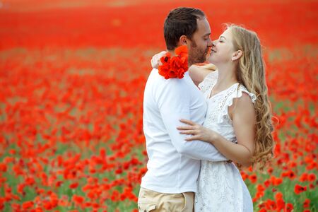 Loving couple in nature. Beautiful man and woman are hugging outdoors.の写真素材