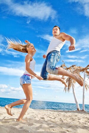 Beautiful man and woman on the sea have a fun rest. Couple in love. High quality photo.の写真素材