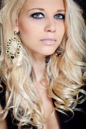 Beautiful woman on a black background.の写真素材