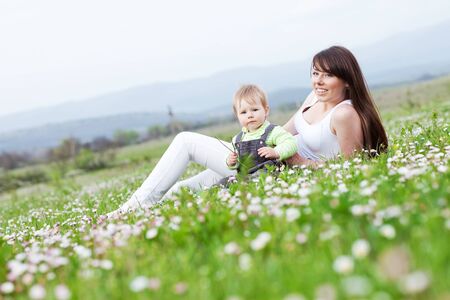 Woman with a child in nature.の写真素材