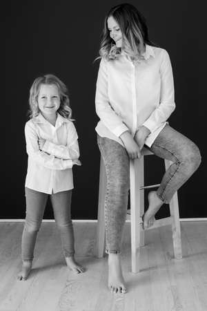 Mother child black white. Woman with child black and white photo. High quality photoの写真素材