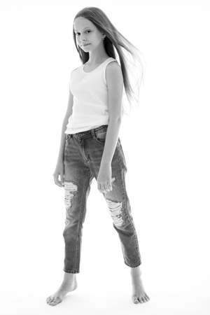 Beautiful child. Little girl in black and white studio. High quality photo.の写真素材