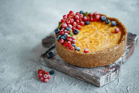 Cheesecake cake with berries. Cake with delicate curd and dough base. High quality photo.の写真素材