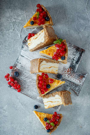 Cheesecake cake with berries. Cake with delicate curd and dough base. High quality photo.の写真素材