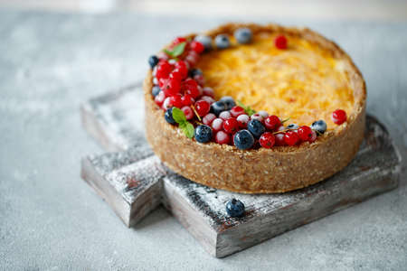 Cheesecake cake with berries. Cake with delicate curd and dough base. High quality photo.の写真素材