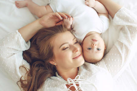 Small child with a woman. Baby with mom. High quality photo.の写真素材