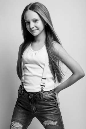 Beautiful child. Little girl in black and white studio. High quality photo.の写真素材