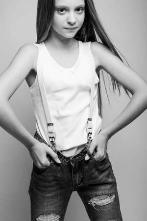 Beautiful child. Little girl in black and white studio. High quality photo.の写真素材