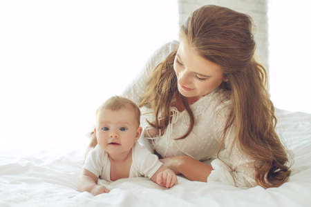 Small child with a woman. Baby with mom. High quality photo.の写真素材