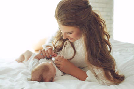 Small child with a woman. Baby with mom. High quality photo.の写真素材