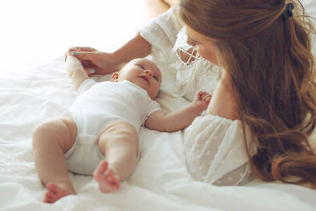 Small child with a woman. Baby with mom. High quality photo.の写真素材