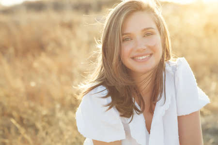 Beautiful woman. Portrait of a young girl in nature. High quality photo.の写真素材