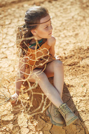 Childrens fashion. Fashionable child. Girl outdoors in fashionable clothes. High quality photo.の写真素材