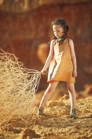 Childrens fashion. Fashionable child. Girl outdoors in fashionable clothes. High quality photo.