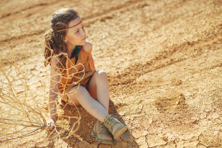 Childrens fashion. Fashionable child. Girl outdoors in fashionable clothes. High quality photo.の写真素材