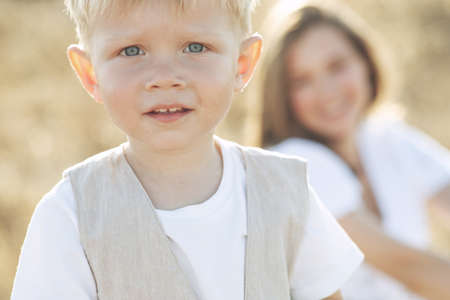 Beautiful woman with a child in nature. High quality photo.の写真素材
