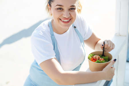 Fat woman on a diet. Proper nutrition. High quality photo.の写真素材