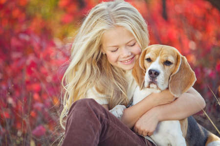 A child in nature with a dog. High quality photo.の写真素材