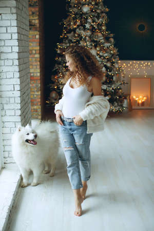 Beautiful woman in Christmas at home, festive decor. High quality photo.の写真素材