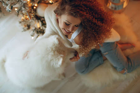 Beautiful woman in Christmas at home, festive decor. High quality photo.の写真素材