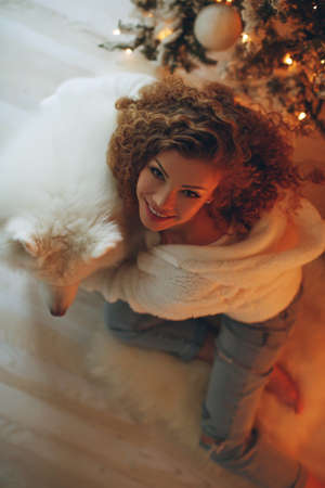 Beautiful woman in Christmas at home, festive decor. High quality photo.の写真素材
