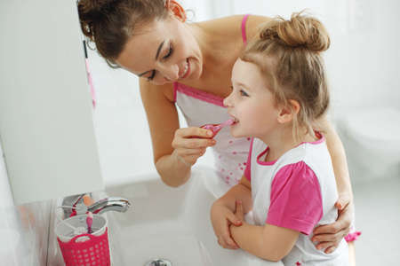 Mom and child brush their teeth. High quality photo.の写真素材