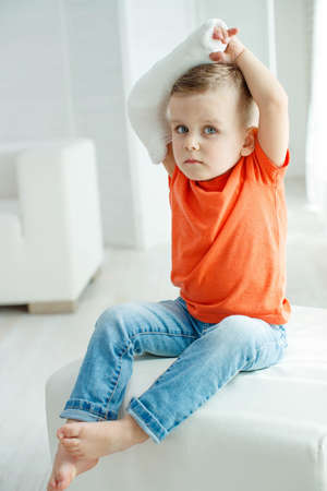 little boy in a cast.child with a broken arm. funny kid after accident. High quality photo.の写真素材