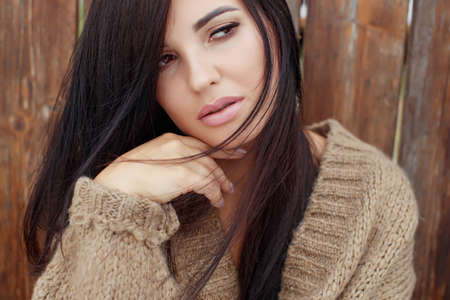 Young smiling woman outdoors portrait. Soft sunny colors Close portrait. High quality photo.の写真素材