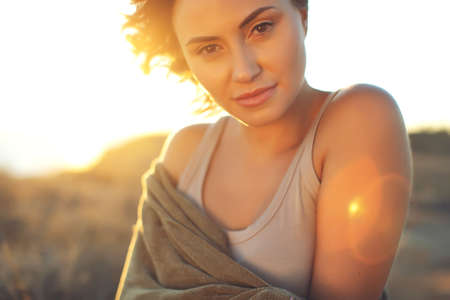 Portrait of a beautiful girl close-up, wind fluttering hair.Young smiling woman outdoors portrait. High quality photo.の写真素材