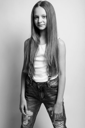 Beautiful child. Little girl in black and white studio. High quality photo.の写真素材