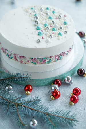 Vanilla sponge cake with cream and white chocolate decorate. Sliced piece of cake on white plate. Favorite dessert for celebrate event or birthday party. High quality photo.の写真素材