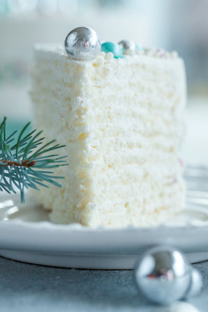 Vanilla sponge cake with cream and white chocolate decorate.の写真素材