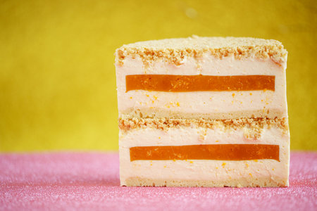 A slice of cheesecake with tangerine filling. Healthy organic summer cake dessert. Dessert. Photo.の写真素材
