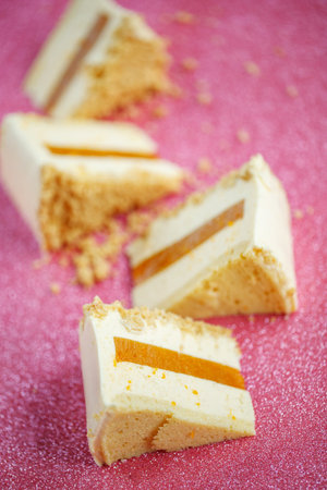A slice of cheesecake with tangerine filling. Healthy organic summer cake dessert. Dessert. Photo.の写真素材