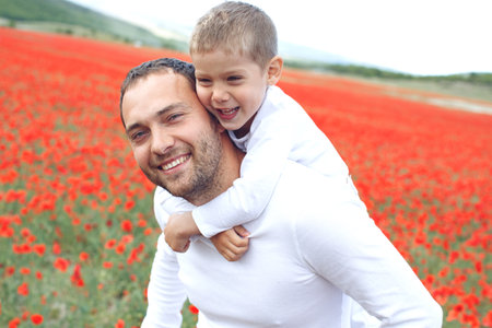 Son and father in nature. The family has fun outdoors. High quality photo.の写真素材