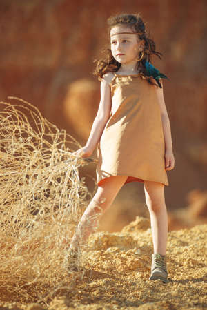 Childrens fashion. Fashionable child. Girl outdoors in fashionable clothes. High quality photo.の写真素材