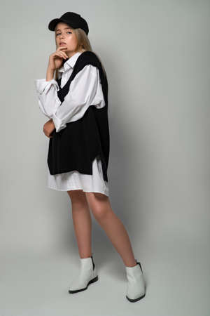 Fashionable teenager girl in the studio. The girl follows fashion and dresses stylishly. High quality photo.の写真素材
