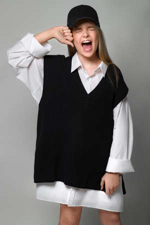 Fashionable teenager girl in the studio. The girl follows fashion and dresses stylishly. High quality photo.の写真素材