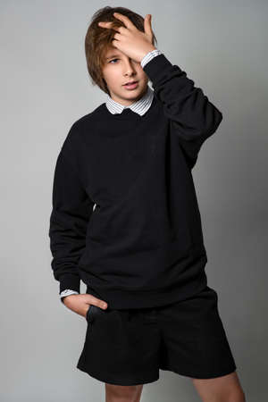 Children style and fashion. Beautiful kids teens in the studio. High quality photo.の写真素材