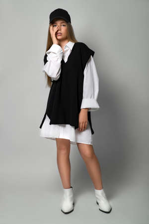 Fashionable teenager girl in the studio. The girl follows fashion and dresses stylishly. High quality photo.の写真素材