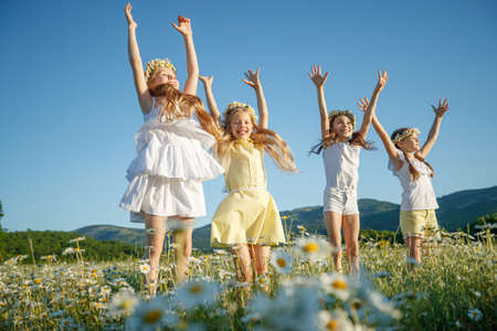Children in nature. The girls play fun. High quality photoの写真素材