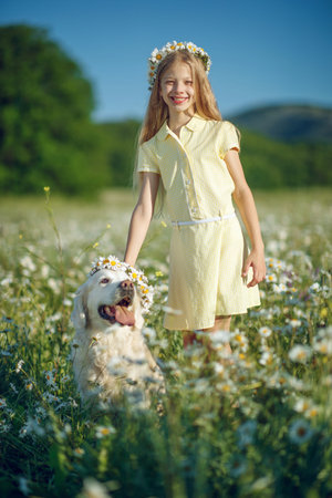 A child with a dog in nature. High quality photoの写真素材