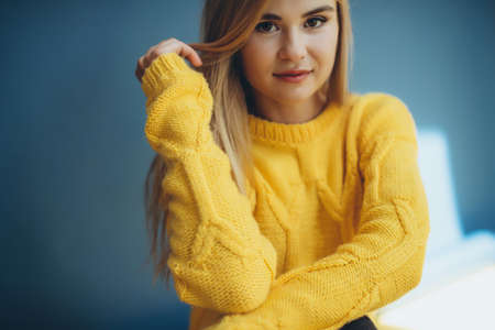 Woman in a sweater in the studio. High quality photoの写真素材