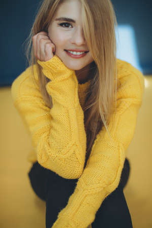 Woman in a sweater in the studio. High quality photoの写真素材
