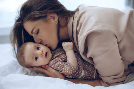 Woman with a baby. Beautiful mother with a baby. High quality photoの写真素材