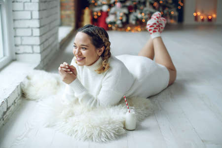 Woman for Christmas. Fat woman on a holiday. High quality photoの写真素材