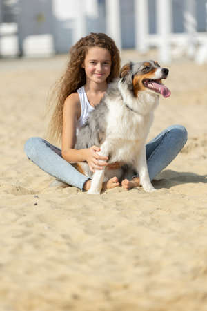 A child with a dog in nature. High quality photoの写真素材