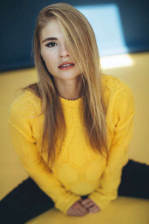 Woman in a sweater in the studio. High quality photoの写真素材